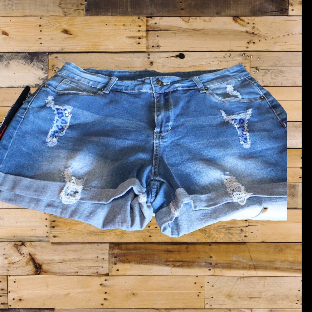New, unbranded Denim shorts, distresses, blue floral camo embellishment, Large